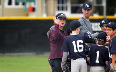 Julie McCleery coaching a youth baseball team
